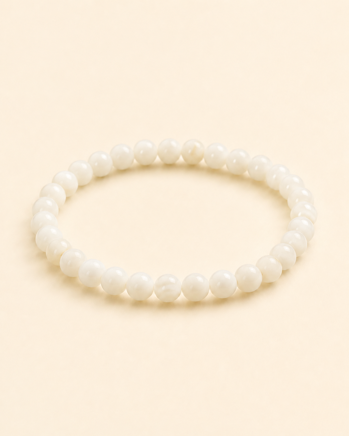Styled view of Soft Tide White Shell Bracelet by AURAM with white shell beads for coastal layering