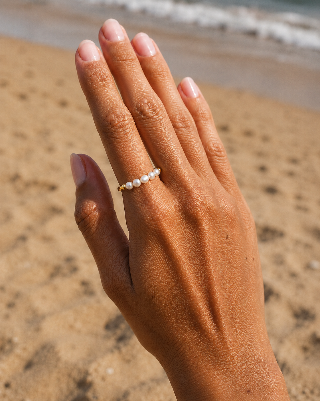 Styled view of Inner Light Baroque Pearl Ring by AURAM with organic baroque pearl detail