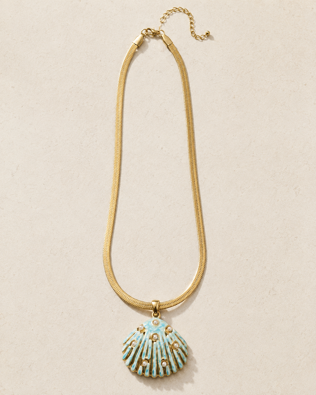 Styled view of Sea Glow Scallop Shell Necklace by AURAM with coastal shell pendant styling