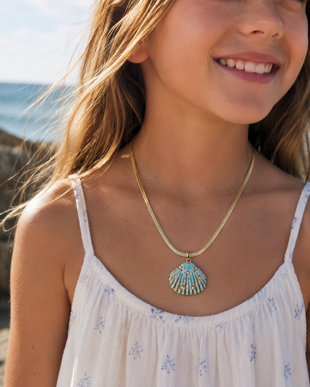 Detail view of Sea Glow Scallop Shell Necklace by AURAM with coastal shell pendant styling