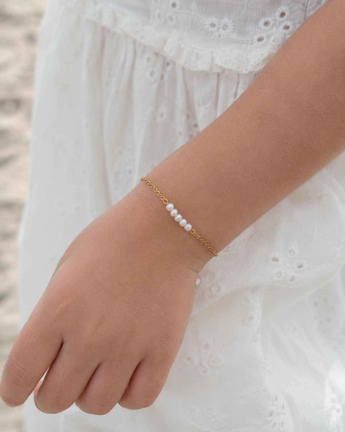 Styled view of A Thread of Light Pearl Bracelet by AURAM with delicate freshwater pearl styling