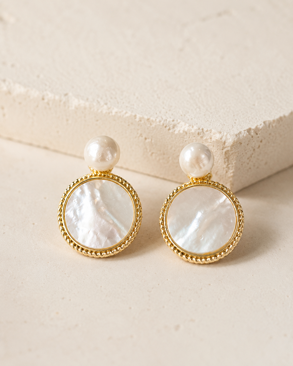 Styled view of Moonlit Shell Pearl Earrings by AURAM with shell-inspired pearl styling