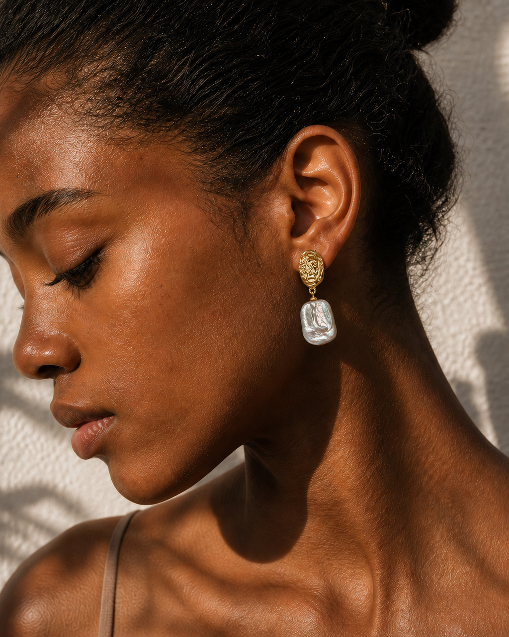 Detail view of Sunlit Relic Baroque Pearl Earrings by AURAM with organic baroque-style pearls