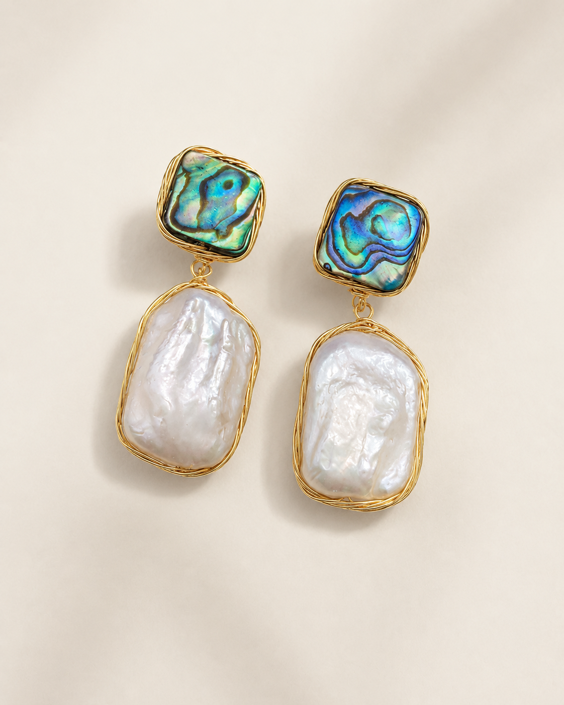 Styled view of Ocean Aura Baroque Pearl Earrings by AURAM with natural pearl glow and coastal styling