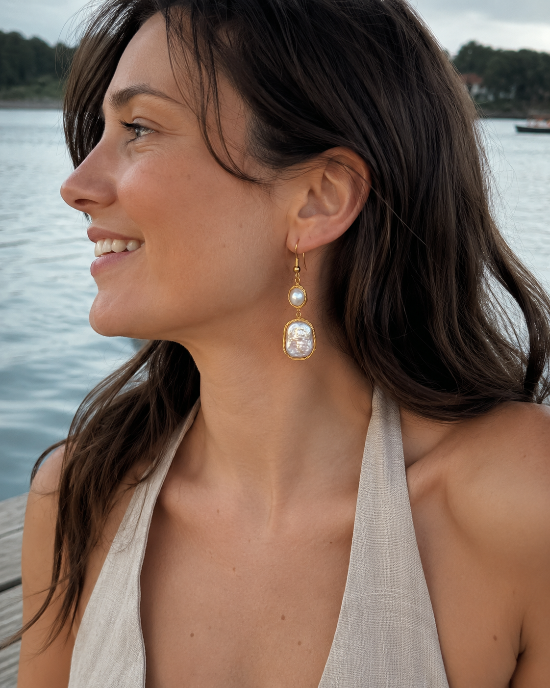 Styled view of Whispering Tide Baroque Pearl Drop Earrings by AURAM with soft coastal pearl styling