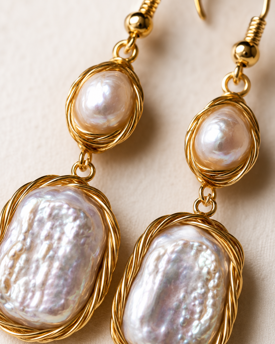 Styled view of Whispering Tide Baroque Pearl Drop Earrings by AURAM with soft coastal pearl styling