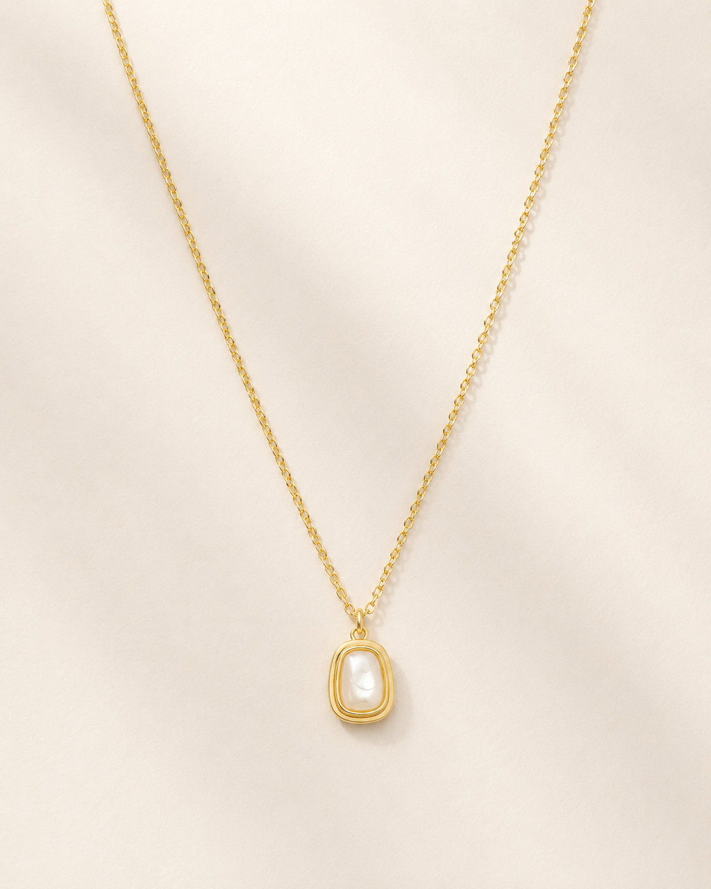 Detail view of Sunlit Tide Mother-of-Pearl Pendant Necklace by AURAM with luminous shell-inspired pendant