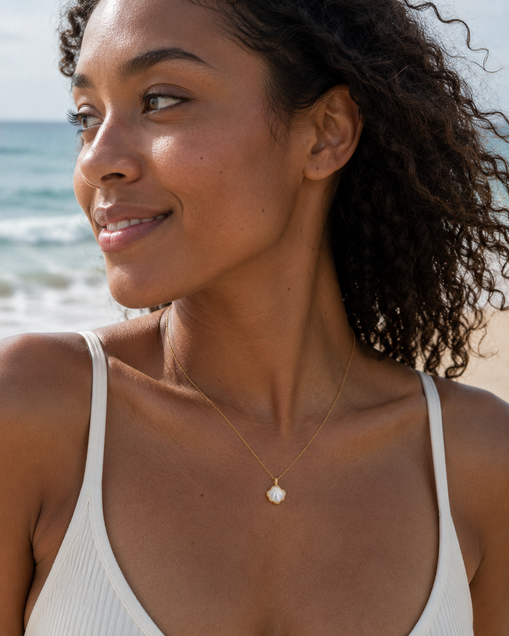Detail view of Shell Bloom Mother-of-Pearl Pendant Necklace by AURAM with floral shell-inspired pendant