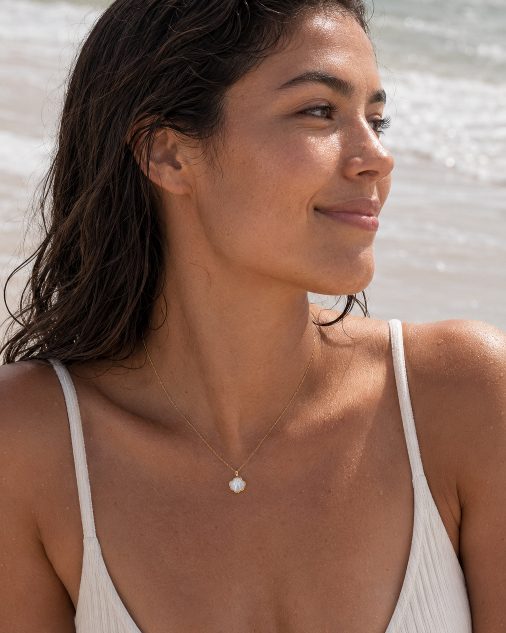 Styled view of Shell Bloom Mother-of-Pearl Pendant Necklace by AURAM with floral shell-inspired pendant