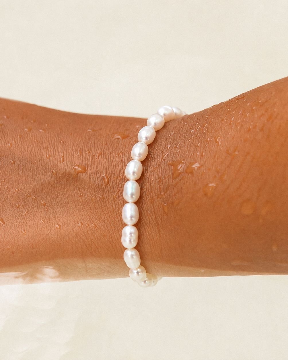 Styled view of Lucky Pearl Bracelet by AURAM with naturally irregular freshwater pearls