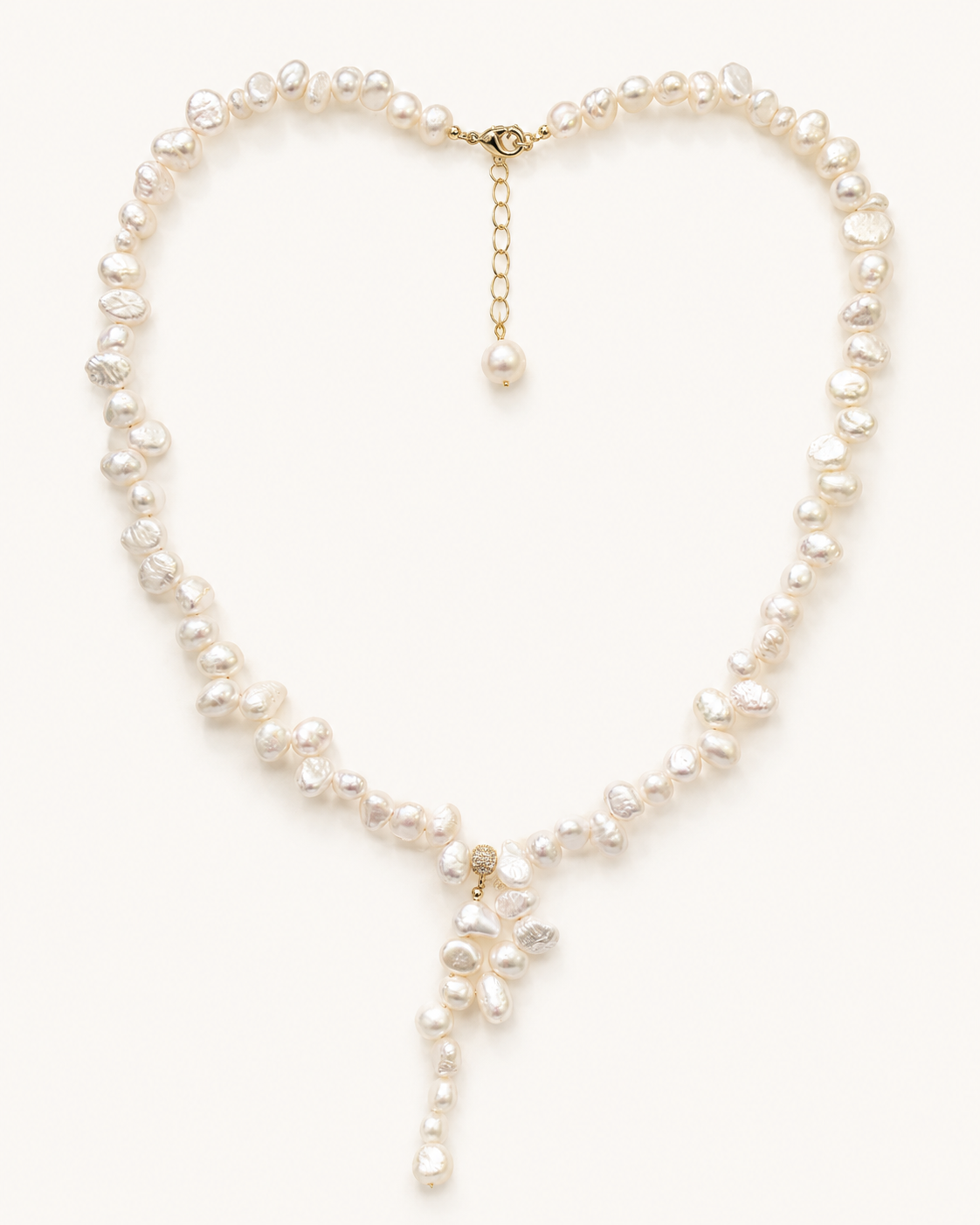 Styled view of Quiet Glow Baroque Pearl Necklace by AURAM with delicate Y-necklace styling