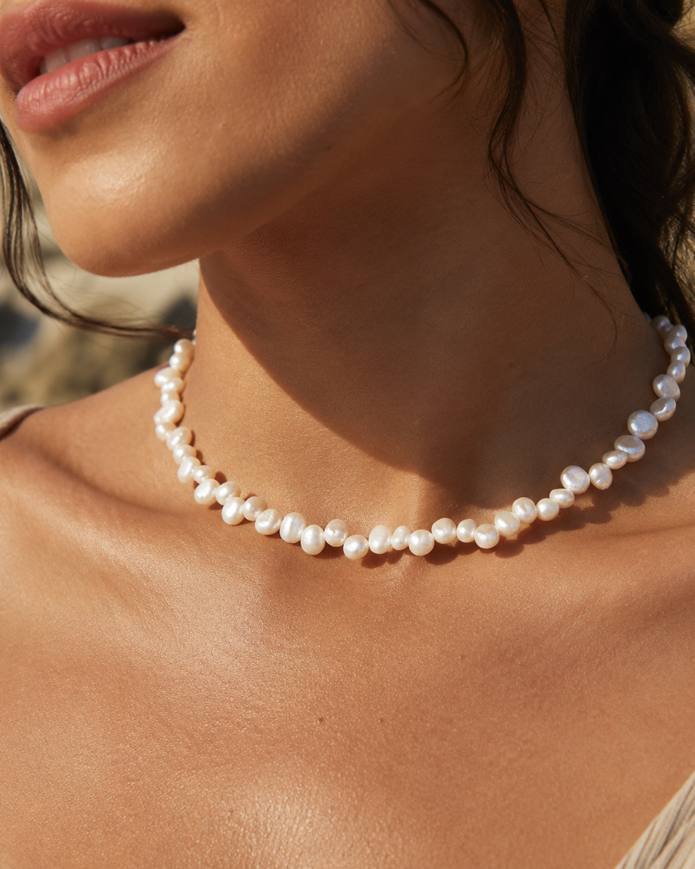 Detail view of Mini Baroque Pearl Choker by AURAM with small organic pearls for modern layering