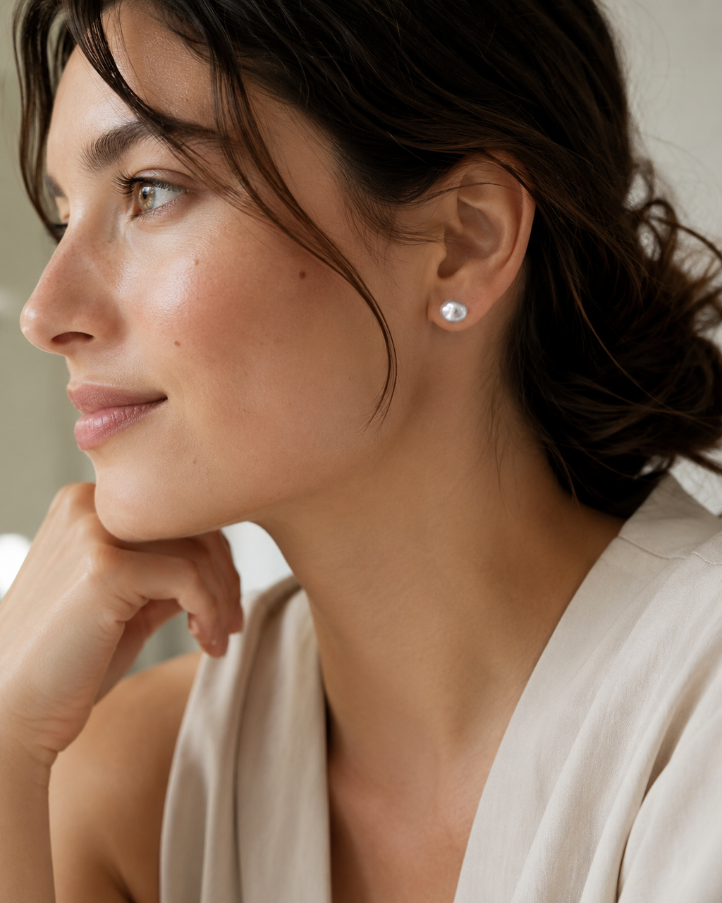 Alternate product view of Tiny Pearl Studs by AURAM, minimal everyday pearl stud earrings
