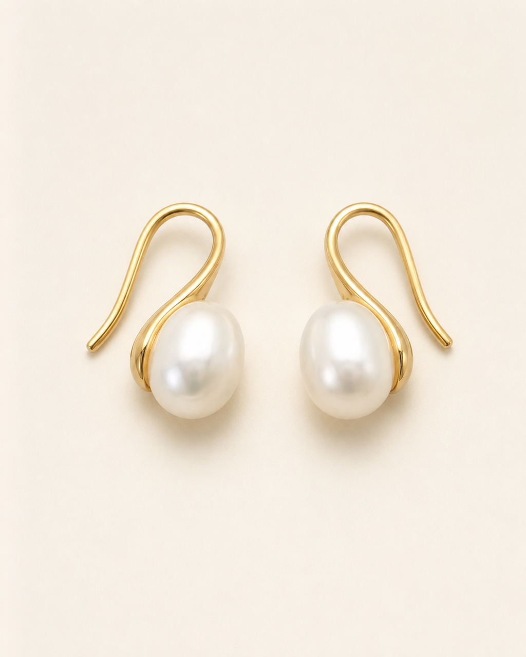 Additional view of Luna Curve Pearl Earrings by AURAM, modern pearl earrings with soft gold-tone curve styling