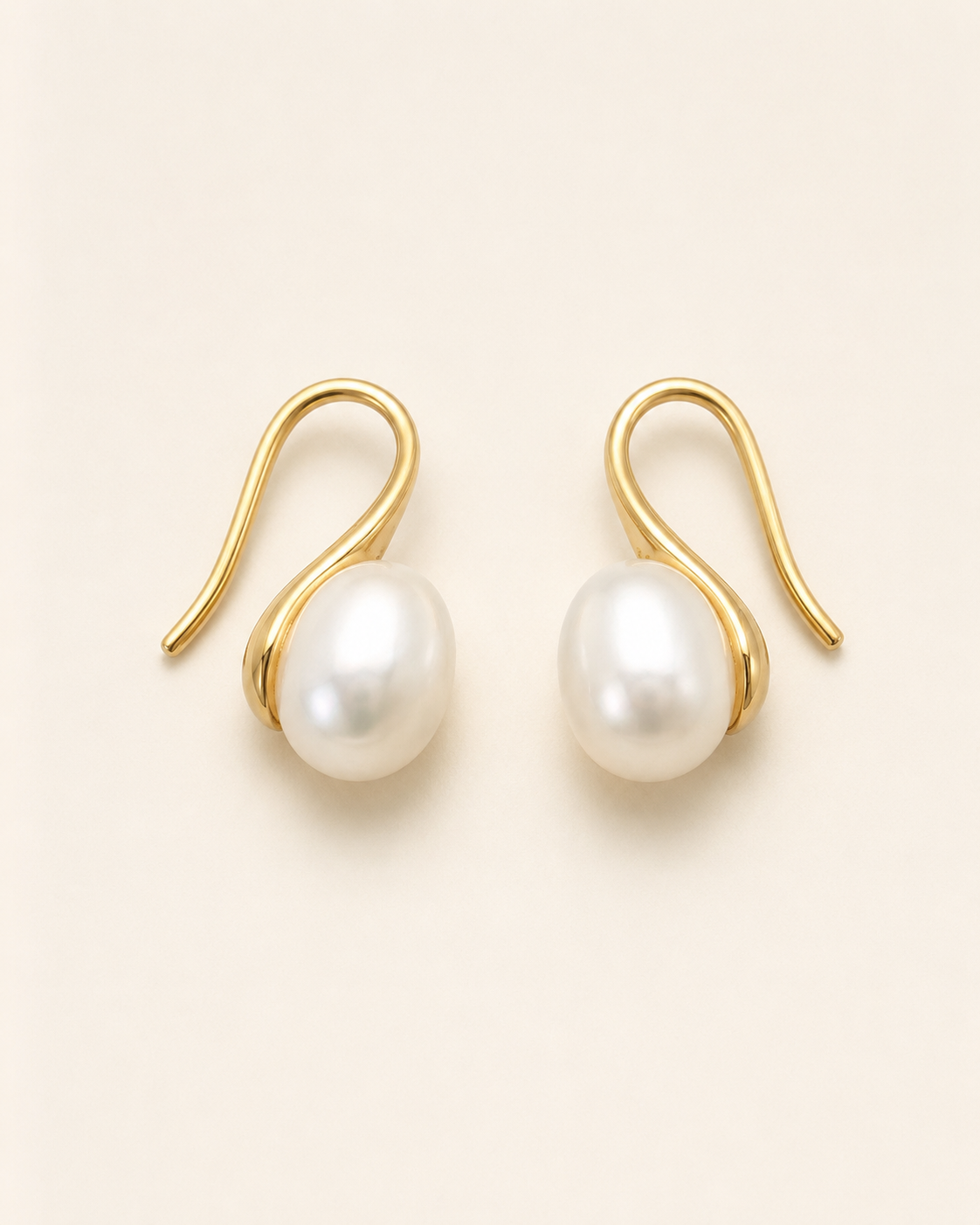 Additional view of Luna Curve Pearl Earrings by AURAM, modern pearl earrings with soft gold-tone curve styling