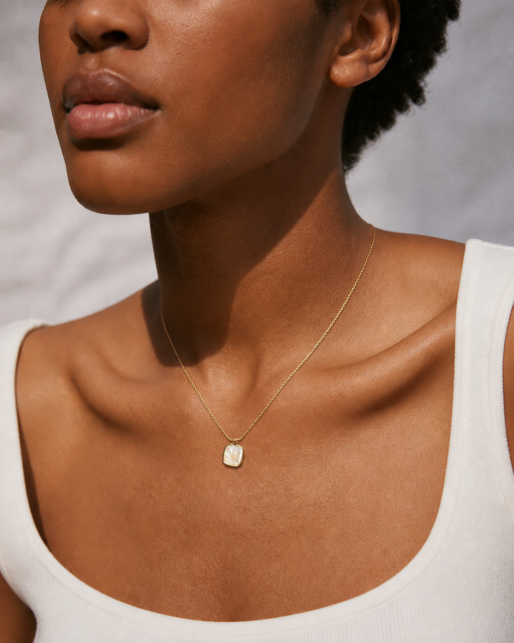 Additional view of Shell Glow Pendant Necklace by AURAM with luminous shell-style pendant and gold-tone chain