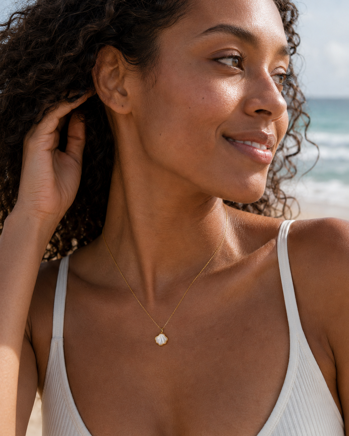 Styled view of Shell Bloom Mother-of-Pearl Pendant Necklace by AURAM with floral shell-inspired pendant