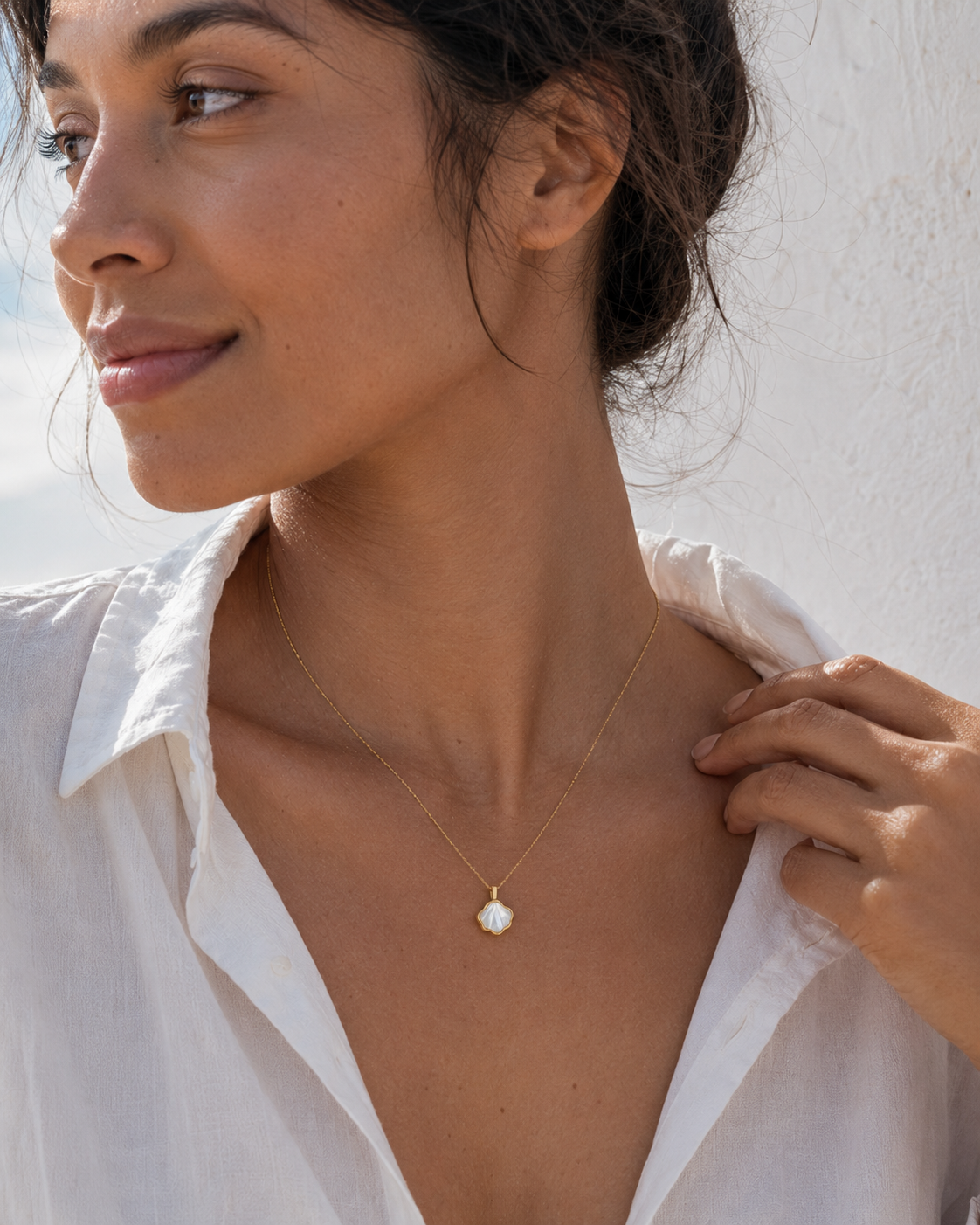 Detail view of Shell Bloom Mother-of-Pearl Pendant Necklace by AURAM with floral shell-inspired pendant