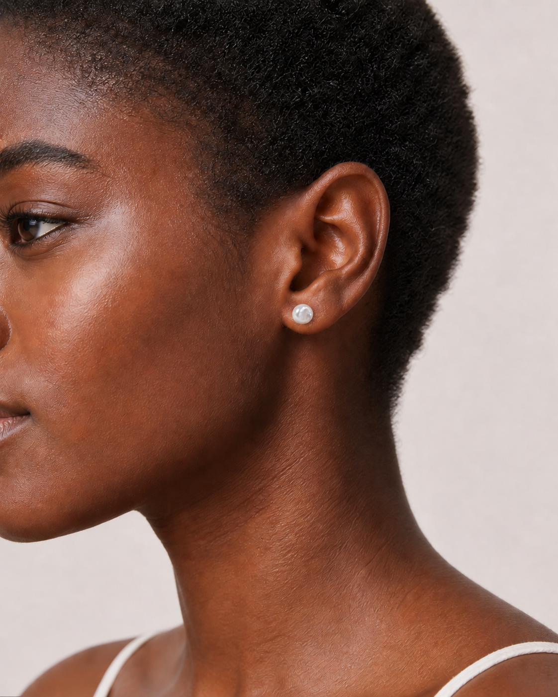 Styled view of Tiny Pearl Studs by AURAM, minimal everyday pearl stud earrings
