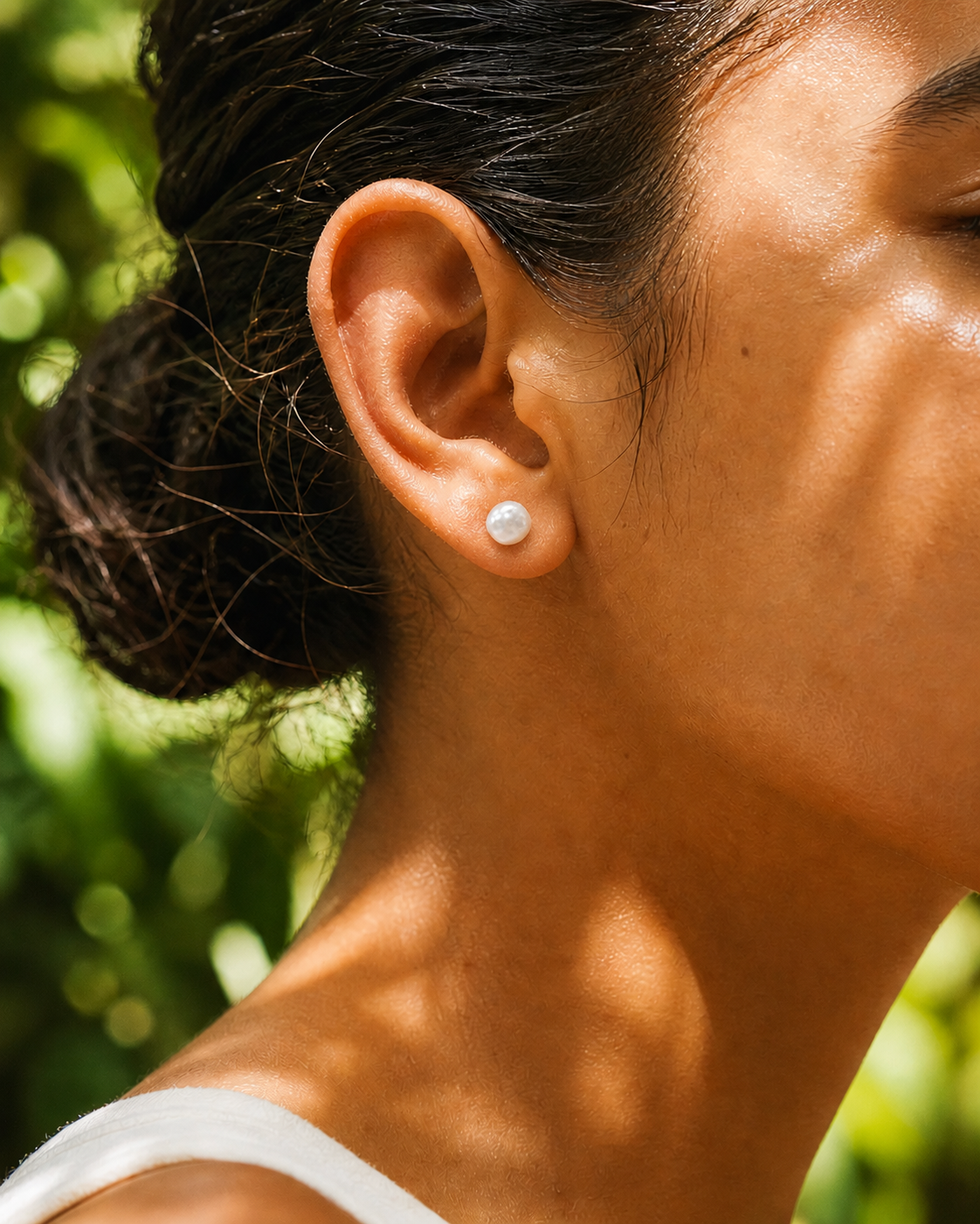 Detail view of Tiny Pearl Studs by AURAM, minimal everyday pearl stud earrings