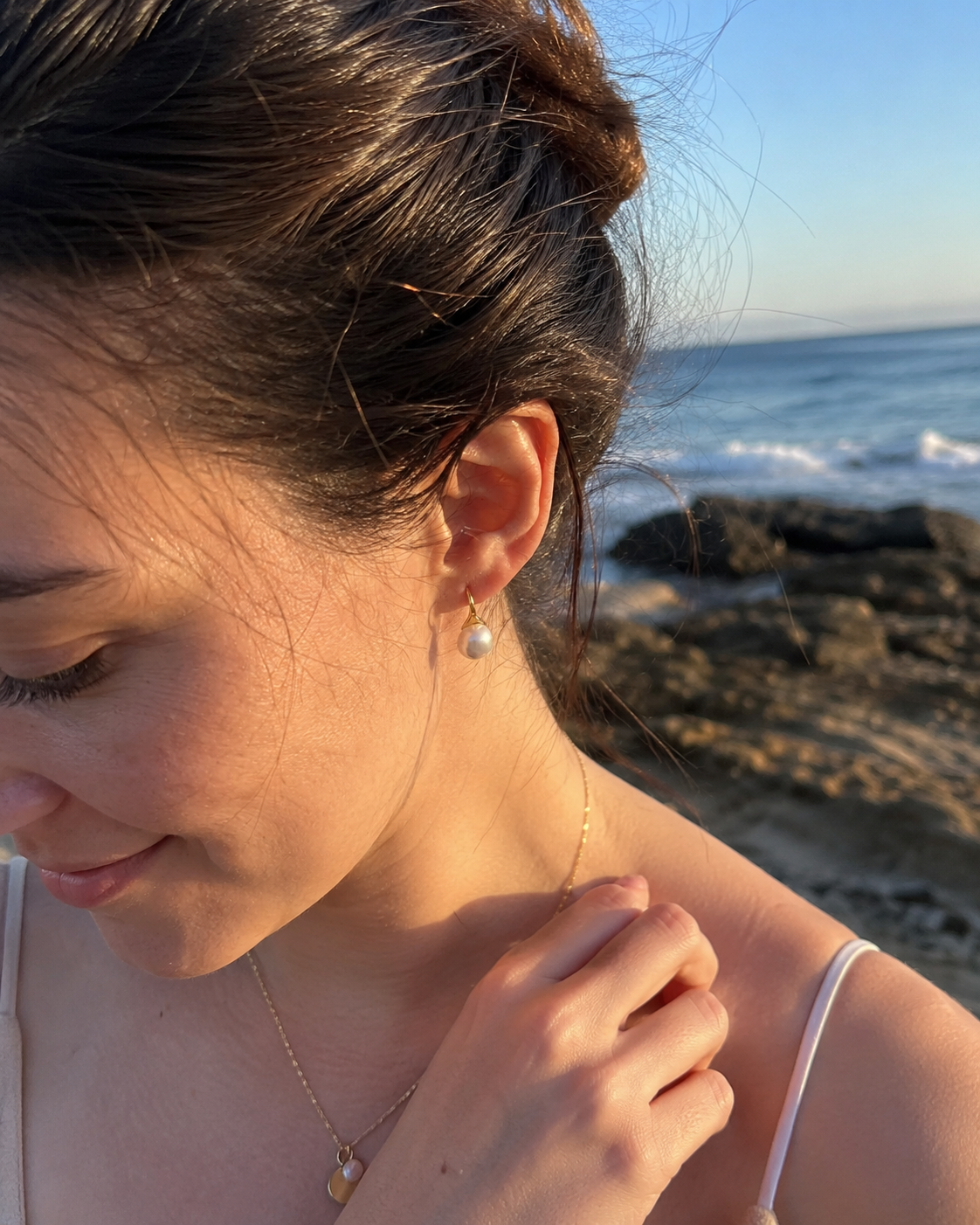 Alternate product view of Luna Curve Pearl Earrings by AURAM, modern pearl earrings with soft gold-tone curve styling