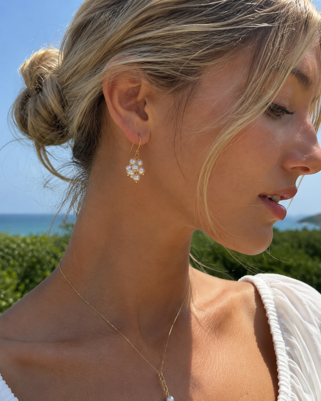 Styled view of Pearl Vine Cluster Earrings by AURAM with clustered pearl and vine-inspired styling